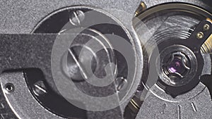 Watch mechanism macro loop. Old vintage clock mechanism working, closeup shot with soft focus. Close up of a internal
