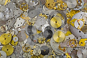 Watch parts in silver golden colors. Small pieces of gears to make charm or DIY jewelry project