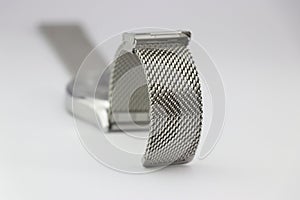 Watch strap made from stainless steel links on a white background