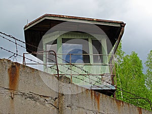 Watch tower behind concrete wall