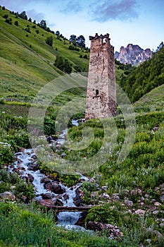 Watch tower and stream in village of Adishi, Svaneti, Georgia photo