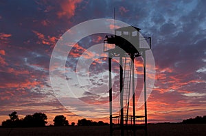 Watch tower on sunset sky