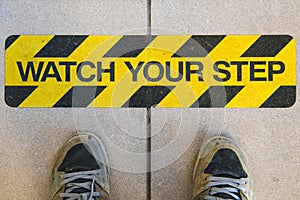 Watch your step construction warning sign