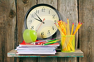 Watches, an apple and school accessories .