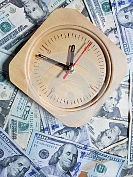 Watches placed against dollar banknotes  Take time to receive money. Time is money.
