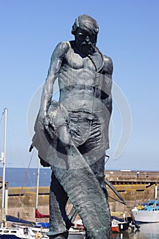 Watchet, UK: bronze statue of the Ancient Mariner at Watchet Harbour