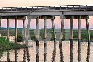 Watching the colorful sunset behind the bridge