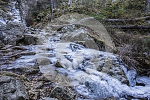 Watching a frozen waterfall while hiking