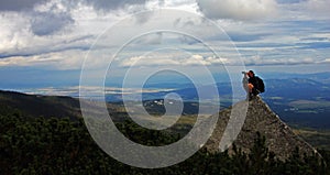 Watching the nature from the top of a peak