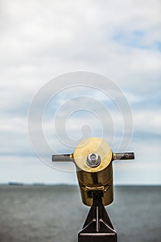 Watching sea trought telescope on a turistic tower