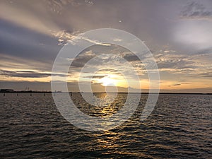 Watching the sun set down to the peaceful ocean of the straights of Melacca at the north port of Klang