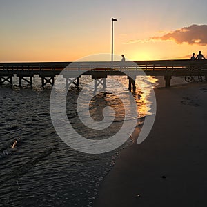 Watching the sunset from a pier