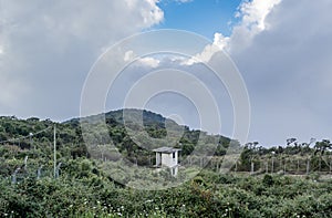 Watching tower at the military base with aerials located at the mountain photo