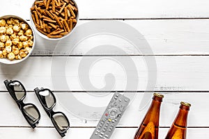 Watching TV with chips, beer and remote control on white background top view mock up