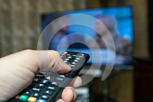 Watching TV and using remote controller