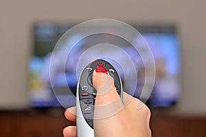 Watching TV and using remote controller