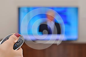 Watching TV and using remote controller