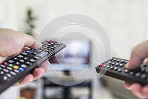 Watching tv and using two remote control