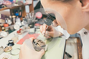 Watchmaker absorbed in her delicate work
