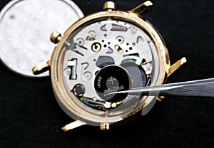 Watchmaker changing battery photo