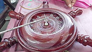 Watchmaker Repair a wall clock