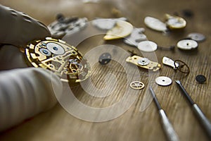 Watchmaker is repairing the mechanical watches in his workshop