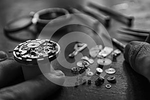 Watchmaker is repairing the mechanical watches in his workshop