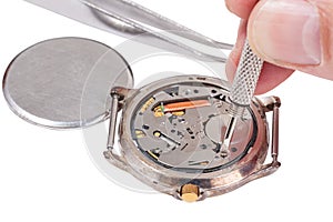 Watchmaker replaces battery in watch