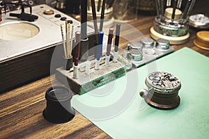 Watchmaker\'s workbench with all specialised tools for watch repair