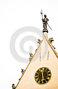 Watchman figure and historic clock on the town hall - isolated photo