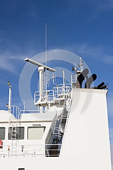 Watchtower, antennas, radar and  other communication and navigation equipment on the command bridge of a ship