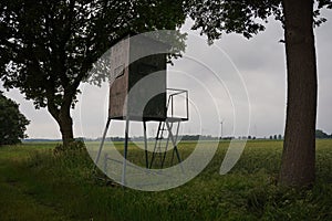 Watchtower on cloudy day, hunting tower and hunting grounds