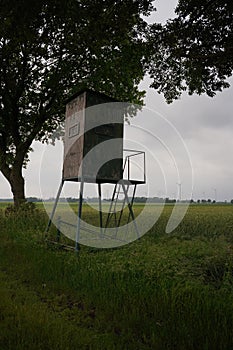 Watchtower on cloudy day, hunting tower, vertical view