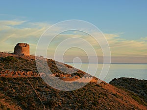 Watchtower in ruins in Sierra Helada. Benidorm Spain . Sunset. Mediterranean