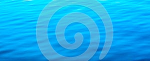 Water abstract background. Blue water ripples texture pattern