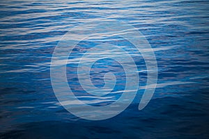 Water background. Calm ocean water surface with small waves and riffles