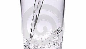 Water being poured into Glass against White Background,