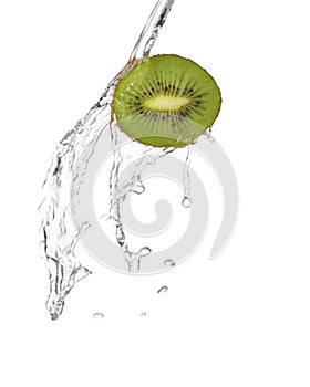 Water being poured in a slice of kiwi isolated