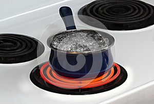Water Boiling In Pan On Stove Top Burner