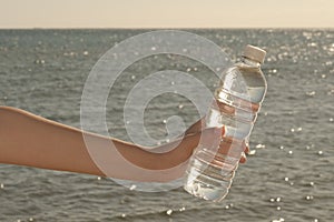 Water bottle in hand