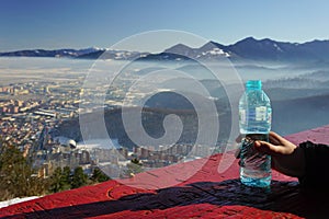 Water bottle and mountains