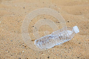 Water bottle placed on the sand.