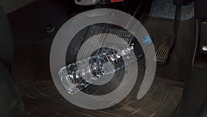 The water bottle rolling hinder car brake ,car safety system on