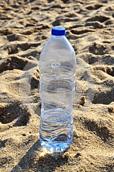 Water bottle on the sand