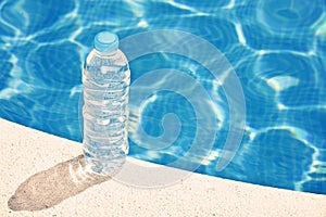 Water bottle by swimming pool