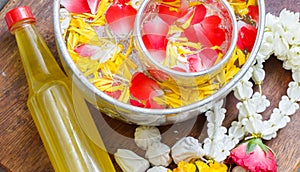 Water in bowl mixed with perfume and vivid flowers corolla , Songkran festival of Thailand