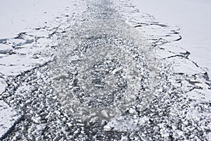 Water with broken ice, the beginning of ship navigation