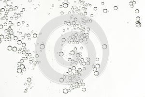 Water bubbles over a beige background