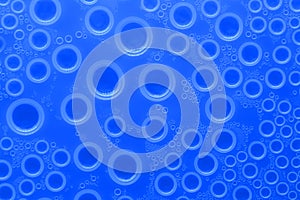 Water bubbles surface.wallpaper phone. background with drops in blue tones. Water bubbles and drops texture.blue circles