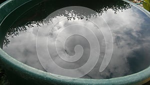 Water on a bucket and the sky